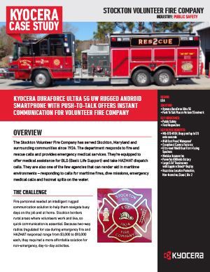 A red fire truck is parked in front of a building.